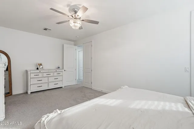 a view of a patio with a table and chairs under an umbrella