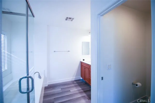 a view of front door with wooden floor