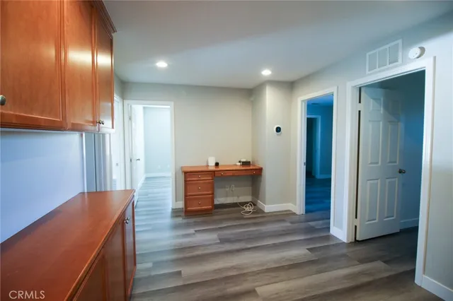 a room with stairs and wooden floor
