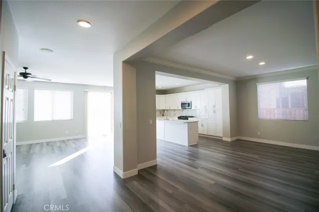 a view of open kitchen with wooden floor