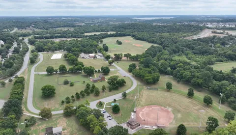 an aerial view of a house with a lake view