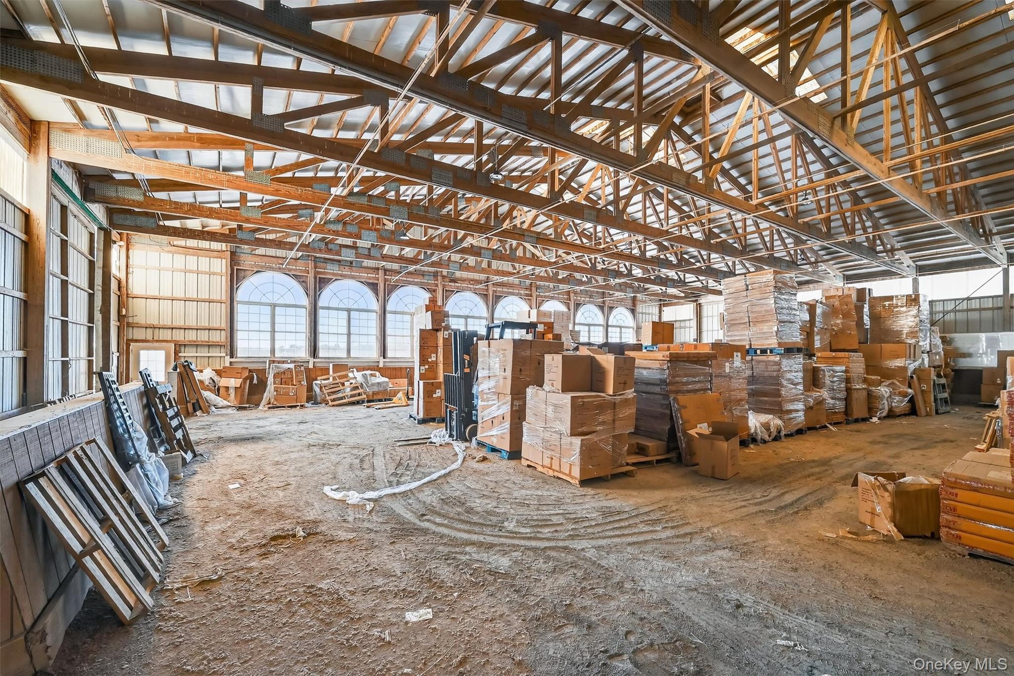 285 Hill Road Goshen, NY 10924 - Photo 36 of 49 Large indoor arena has 8 Palladian windows for plenty of natural light and new overhead lights for evening rides.