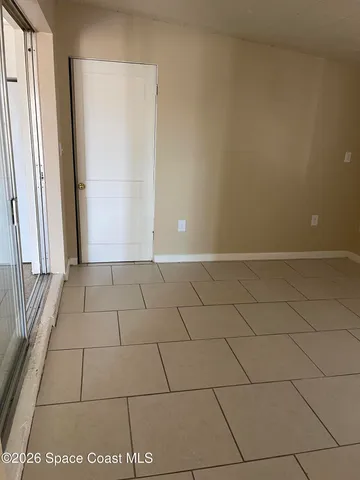 a view of a livingroom with an empty space and a sink