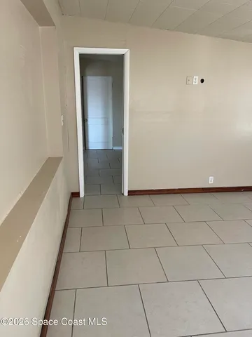 a view of a livingroom with an empty space and a sink