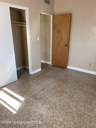 an empty room with closet