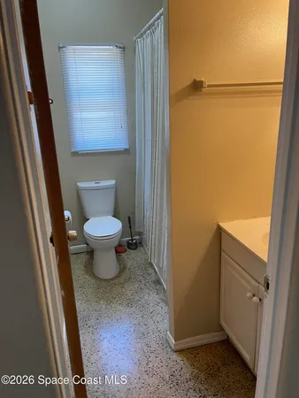 a bathroom with a toilet and a sink
