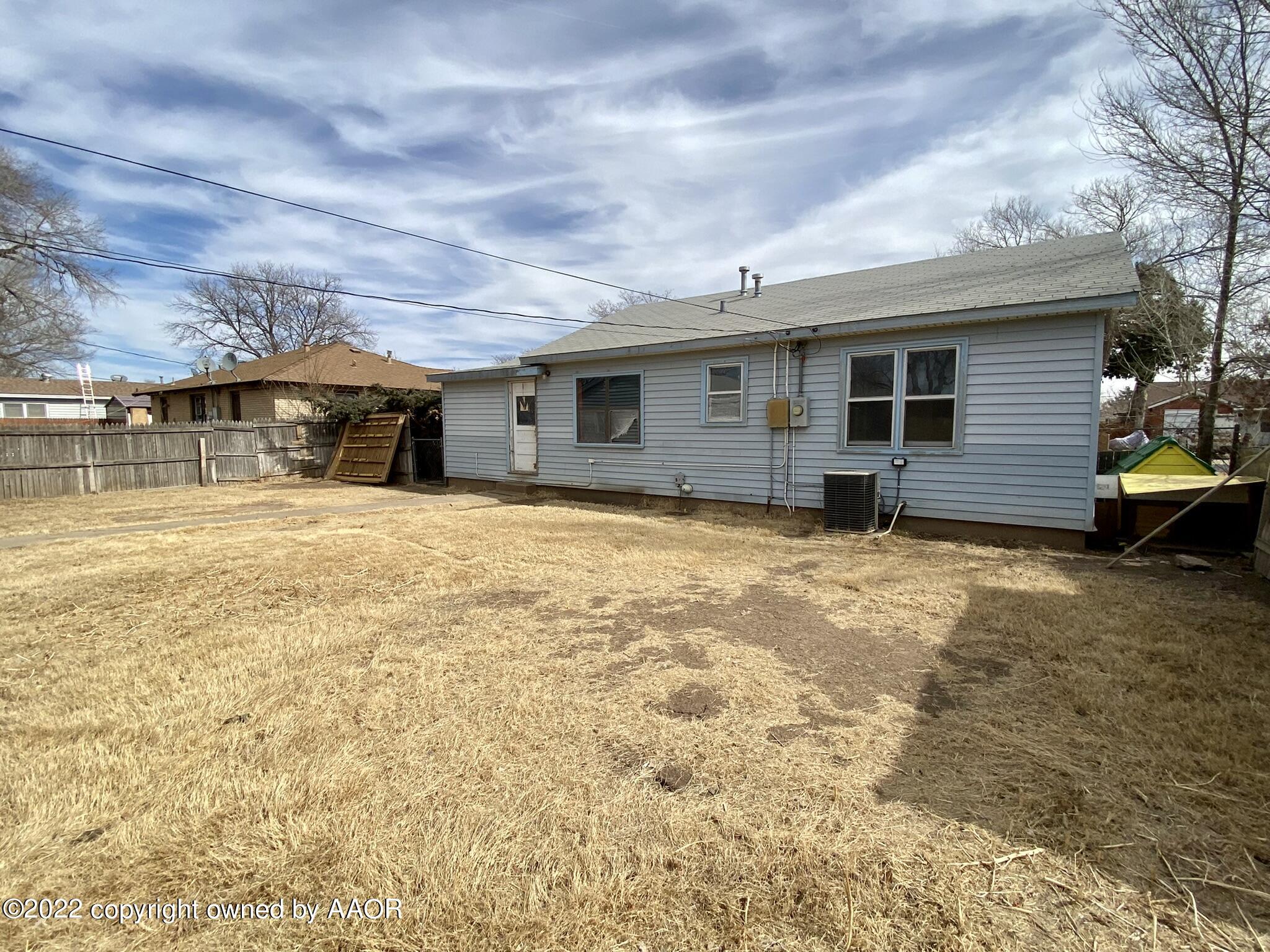 4316 Parker Street Amarillo, TX 79110 - Photo 21 of 27 a view of a house with a yard