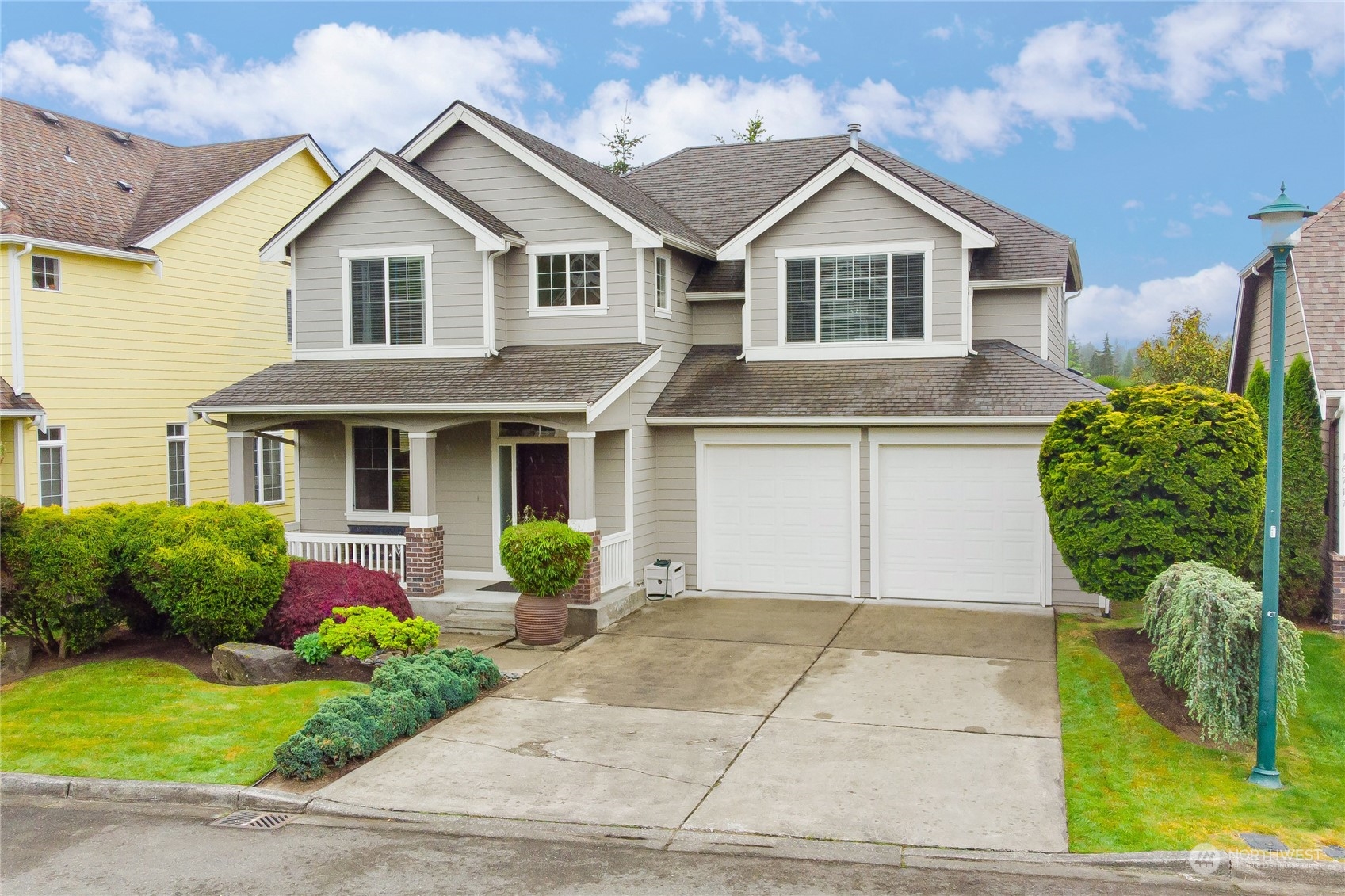 16725 Southeast 173rd Street Renton, WA 98058 - Photo 1 of 37 a front view of a house with garden