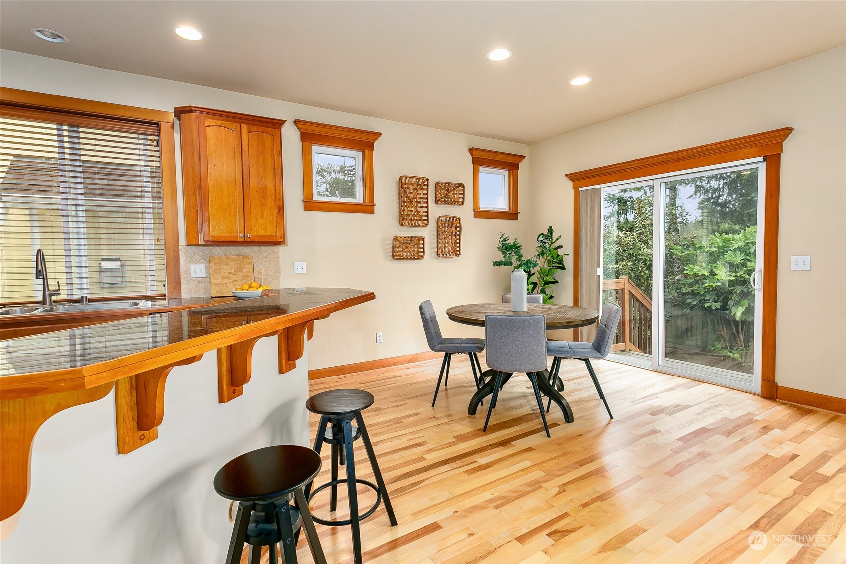 16725 Southeast 173rd Street Renton, WA 98058 - Photo 11 of 37 a dining room with furniture a chandelier and wooden floor