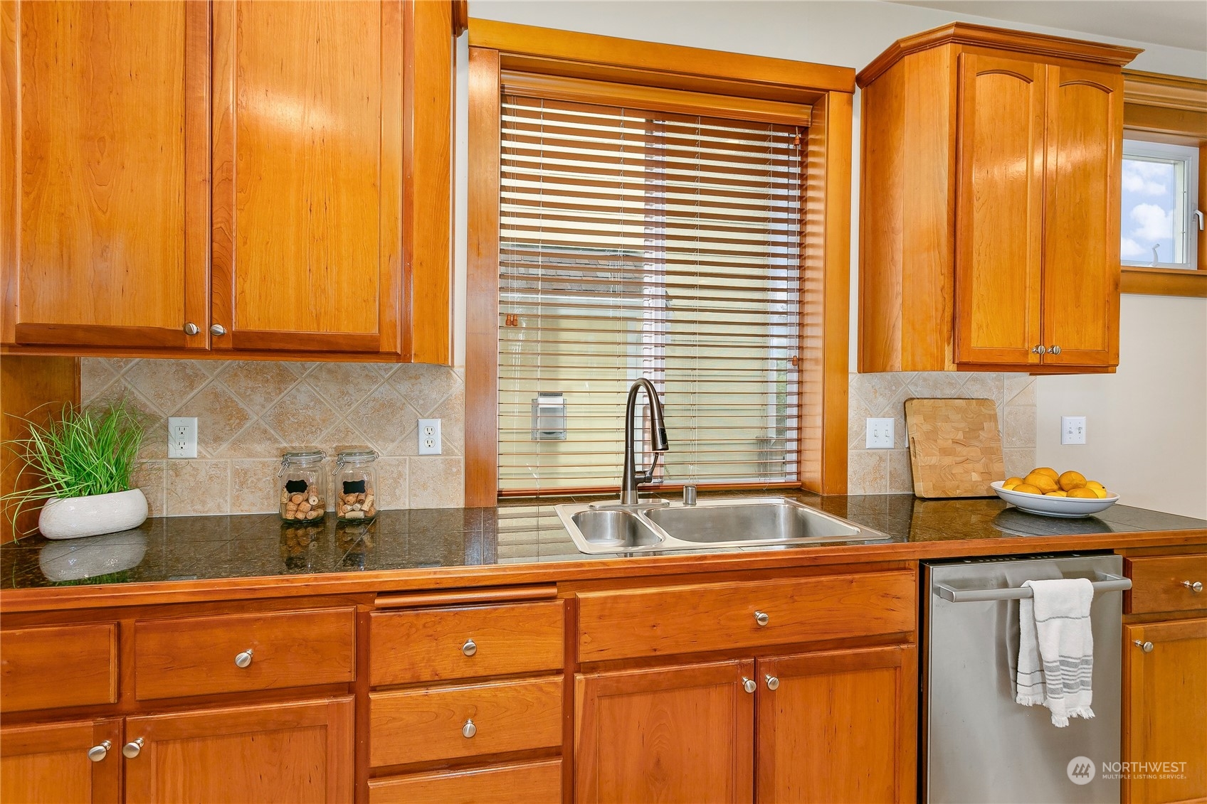 16725 Southeast 173rd Street Renton, WA 98058 - Photo 16 of 37 a kitchen with stainless steel appliances granite countertop a sink and a window