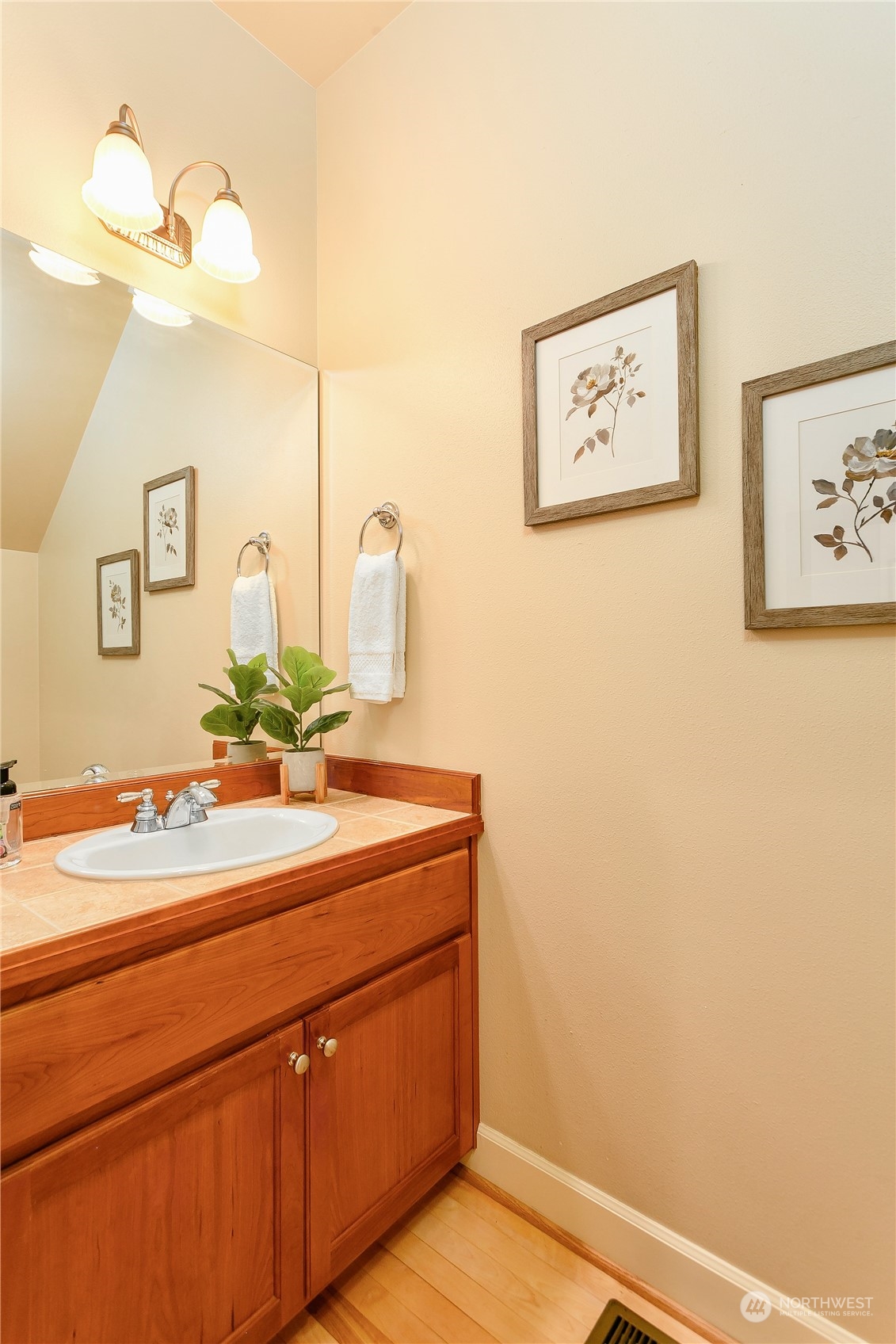 16725 Southeast 173rd Street Renton, WA 98058 - Photo 18 of 37 a bathroom with a sink and a mirror