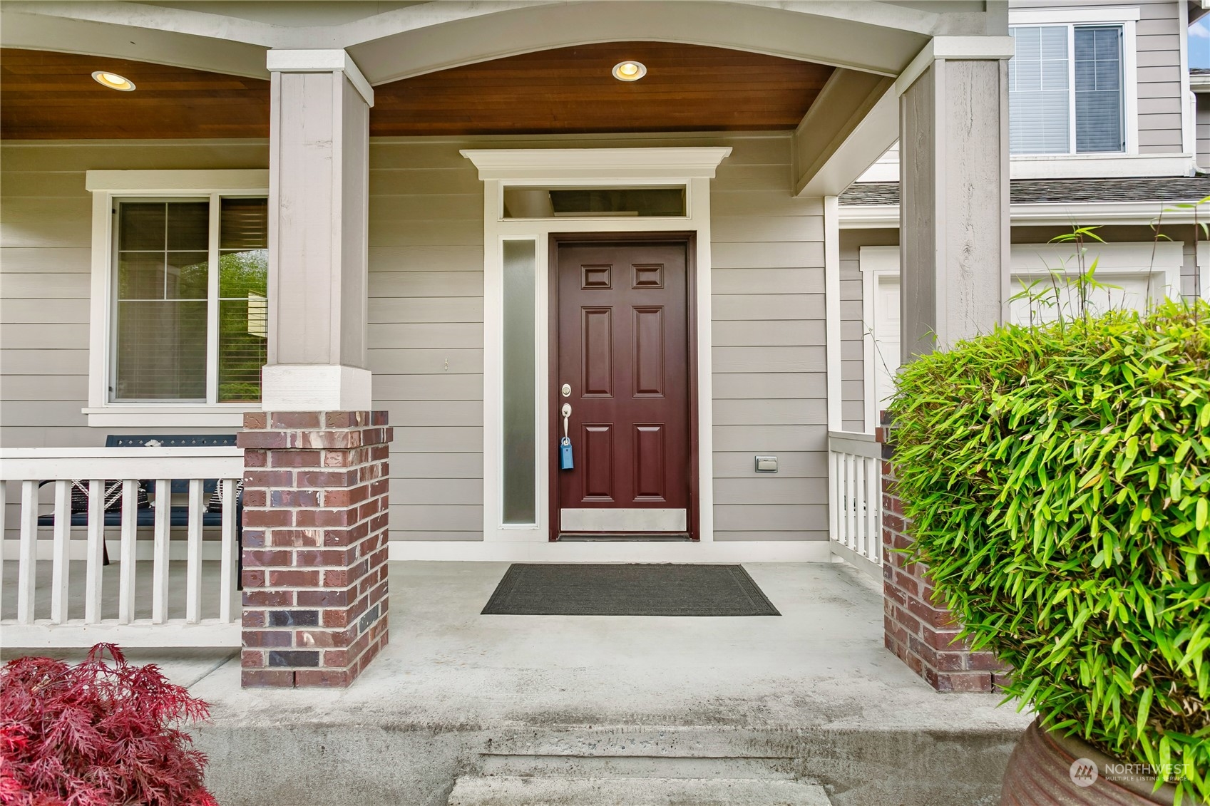 16725 Southeast 173rd Street Renton, WA 98058 - Photo 2 of 37 a front view of a house with a garden