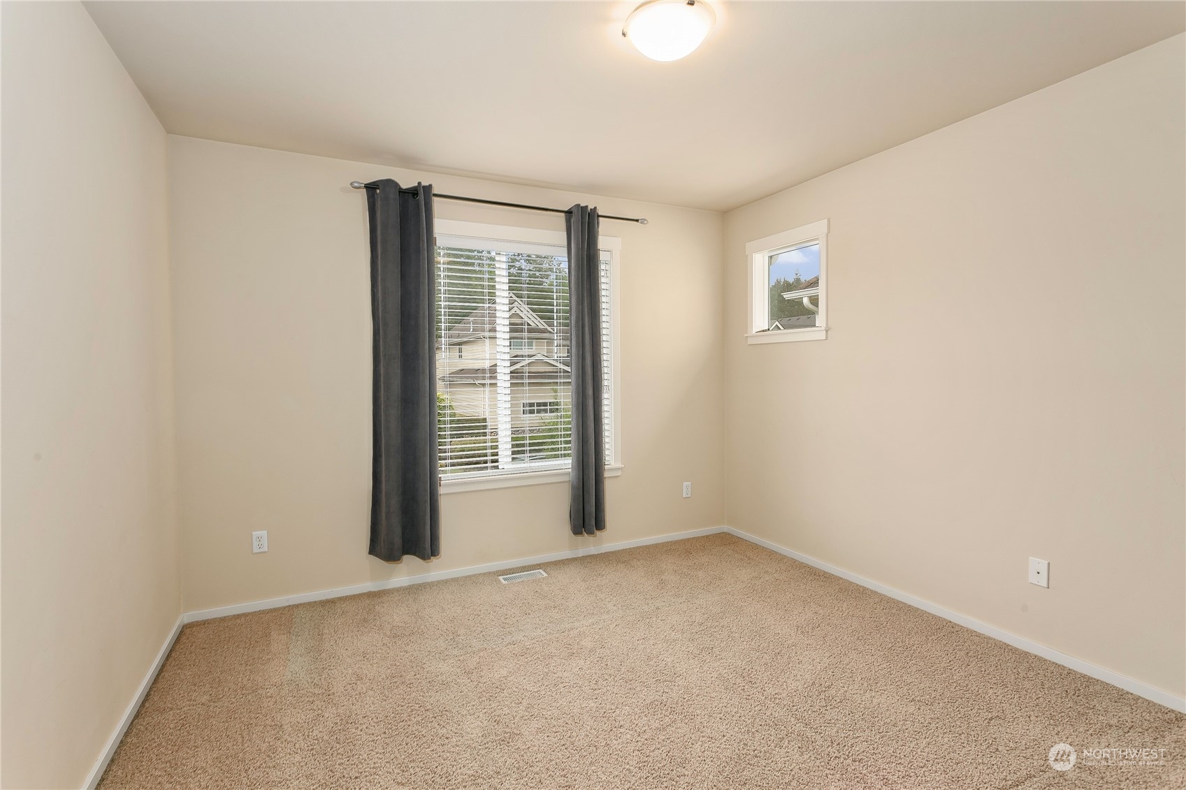 16725 Southeast 173rd Street Renton, WA 98058 - Photo 23 of 37 an empty room with windows