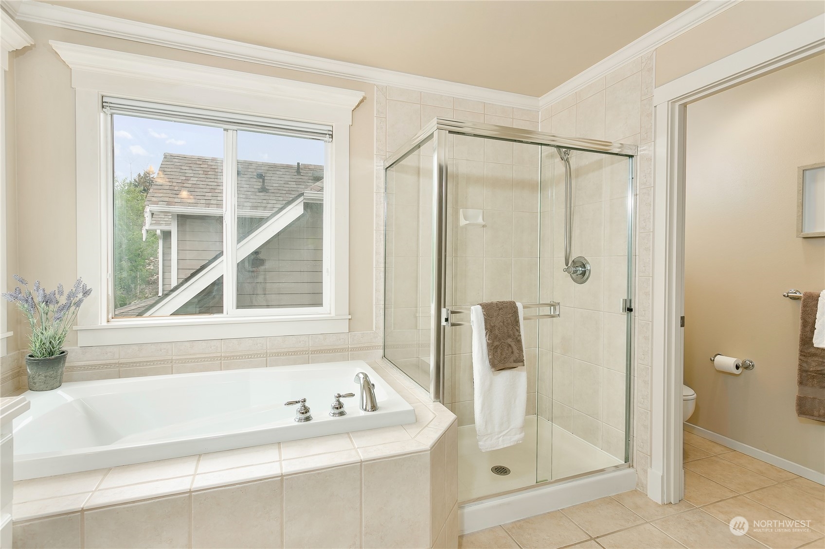 16725 Southeast 173rd Street Renton, WA 98058 - Photo 26 of 37 a bathroom with a tub shower and a sink