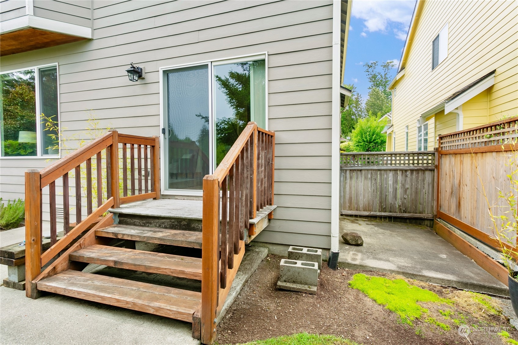 16725 Southeast 173rd Street Renton, WA 98058 - Photo 29 of 37 a view of a balcony with chairs and wooden fence