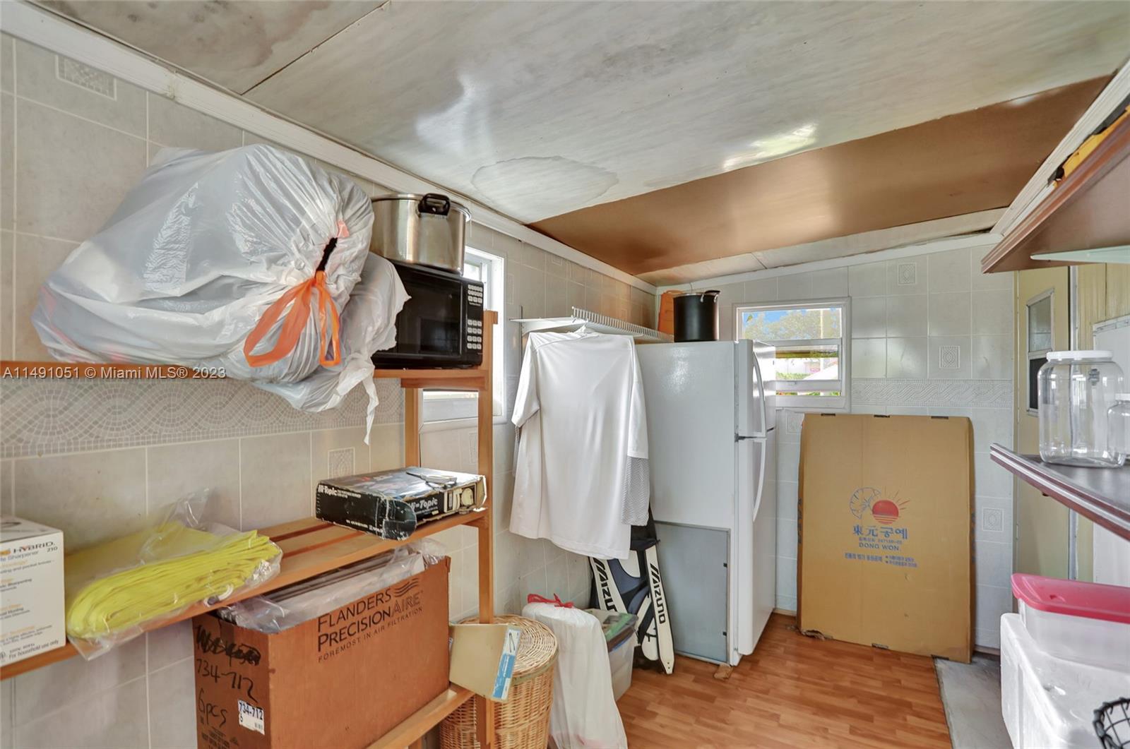 1640 Southwest 66th Avenue Boca Raton, FL 33428 - Photo 22 of 36 a room with storage and utility