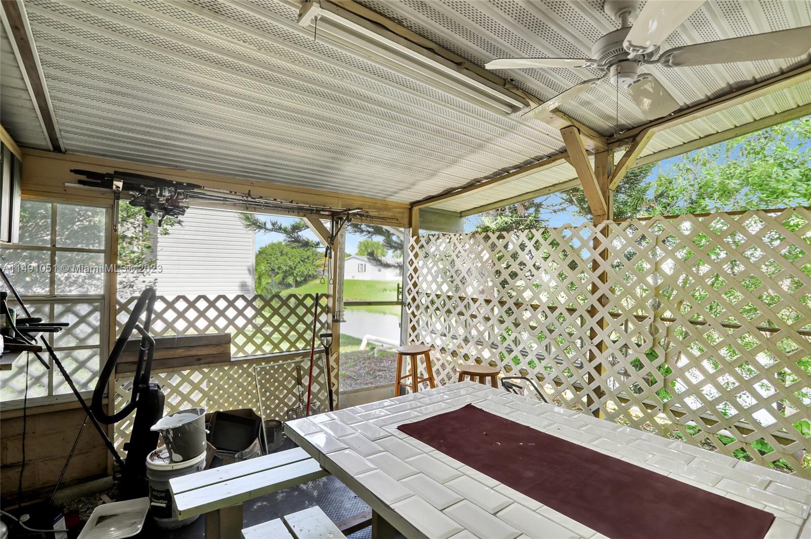1640 Southwest 66th Avenue Boca Raton, FL 33428 - Photo 29 of 36 a view of a porch with furniture
