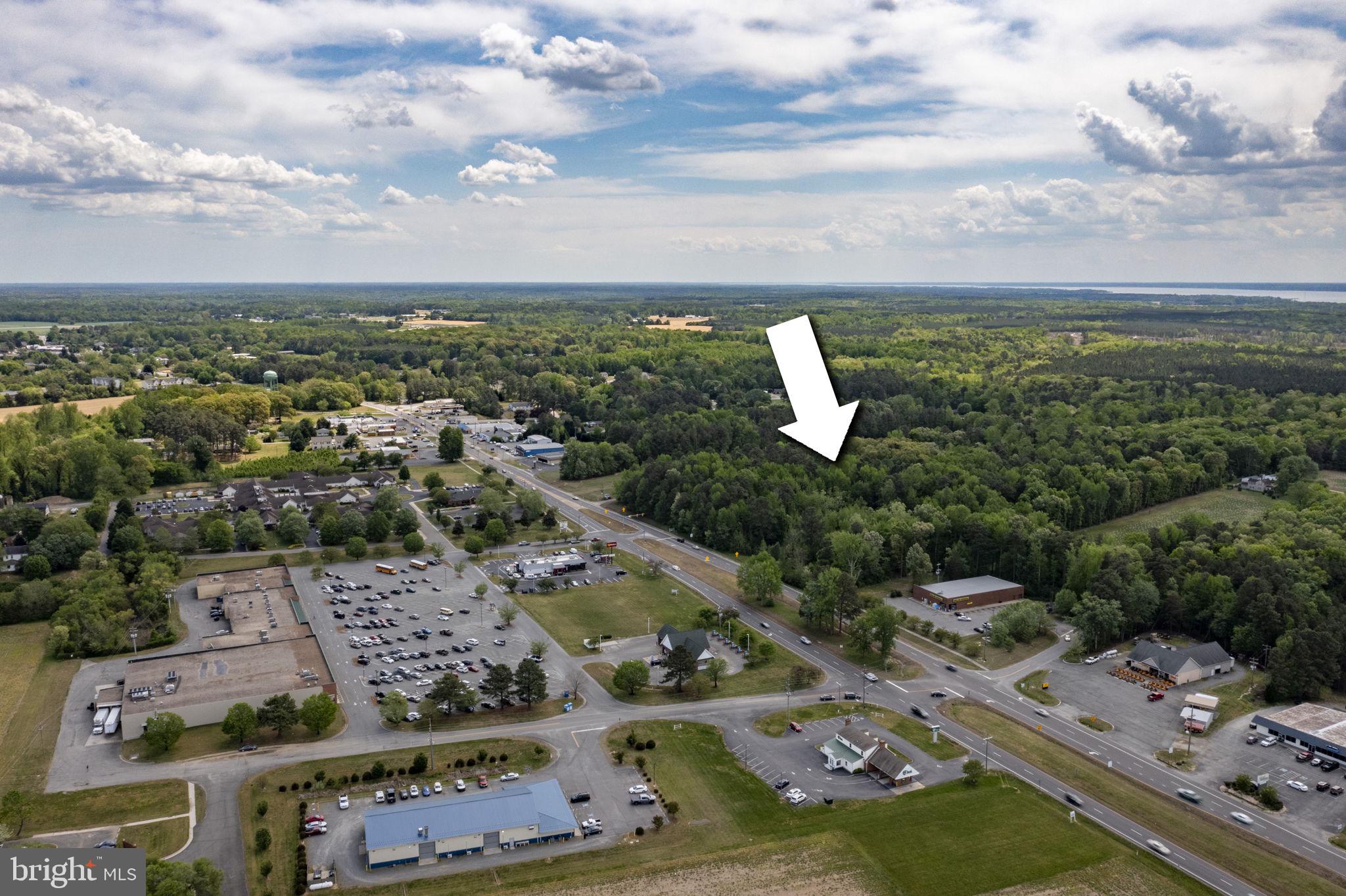 0 Richmond Road Warsaw, VA 22572 - Photo 6 of 9 an aerial view of a city with lots of residential buildings ocean and mountain view in back