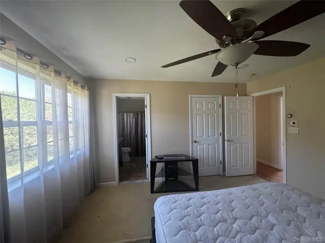 a view of a livingroom with furniture and entryway