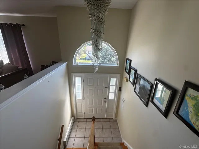 a view of a livingroom with wooden floor and a window