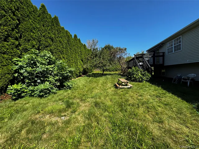 a backyard of a house with lots of green space