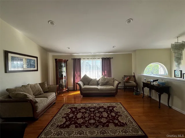 a living room with furniture and a rug