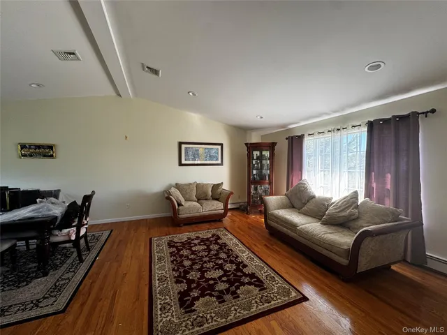 a living room with furniture rug and window