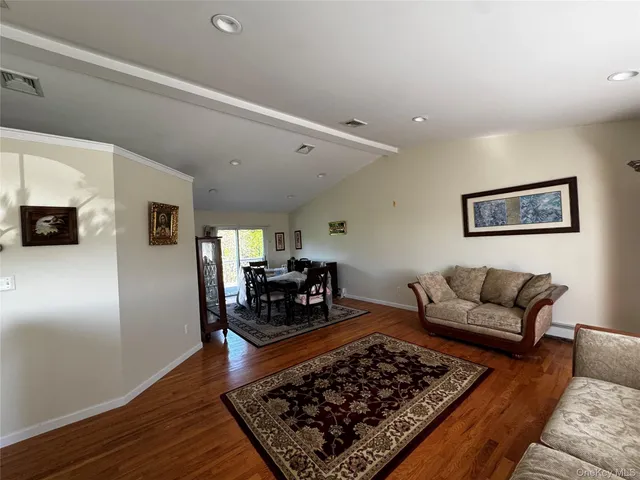 a living room with furniture and a rug