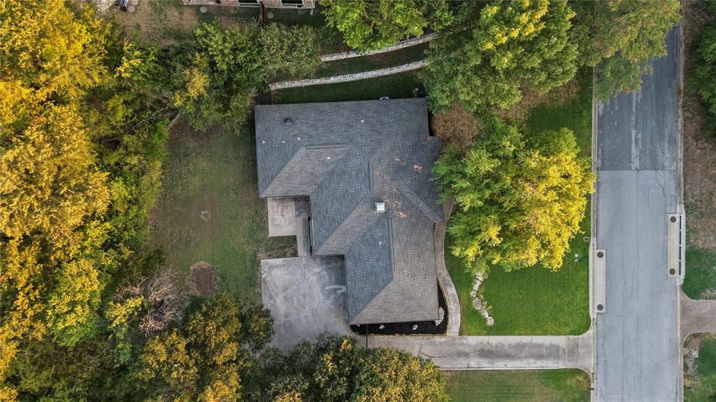 257 Willow Ridge Road Fort Worth, TX 76103 - Photo 23 of 29 Private yard surrounded by trees