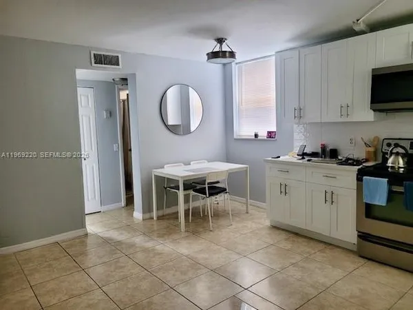 a kitchen with a stove microwave and refrigerator