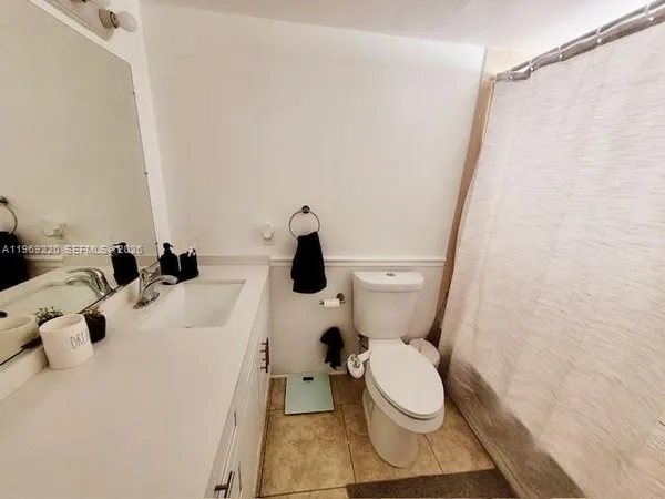 a bathroom with a double vanity sink and mirror