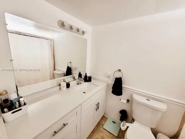 a living room with a bed and furniture