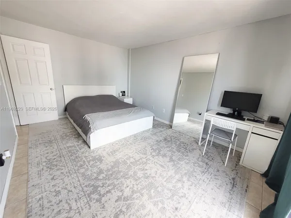 a view of a livingroom with furniture and closet