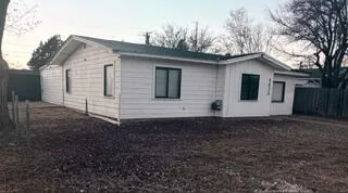 a house view with a backyard space