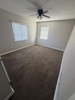 4630 Detroit Avenue Lubbock, TX 79413 - Photo 11 of 16 an empty room with windows and ceiling fan