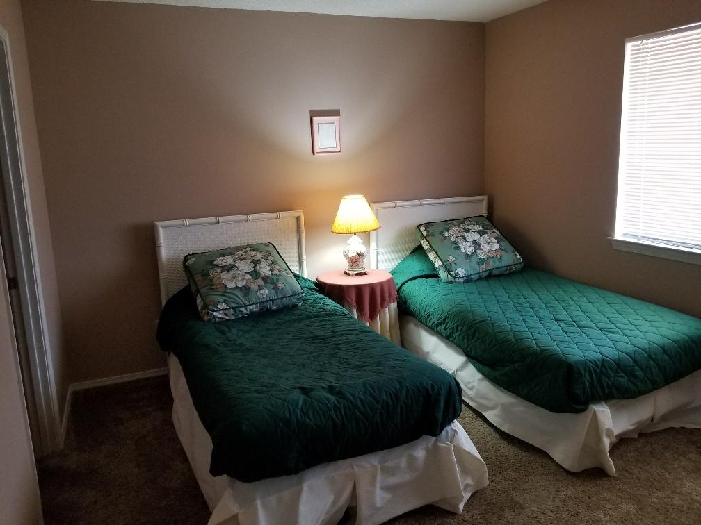 60 Sandprints Drive, Unit A2 Miramar Beach, FL 32550 - Photo 14 of 23 a bed sitting in a bedroom next to a window