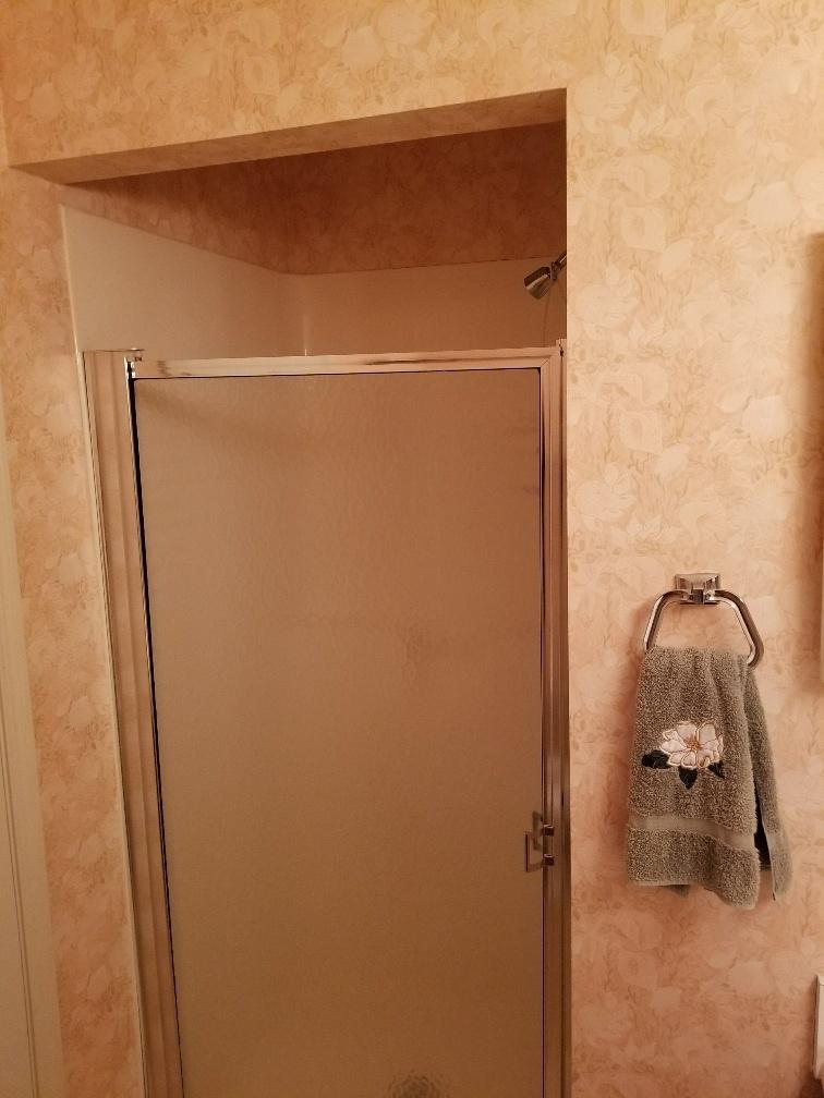 60 Sandprints Drive, Unit A2 Miramar Beach, FL 32550 - Photo 17 of 23 a bathroom with a glass shower door