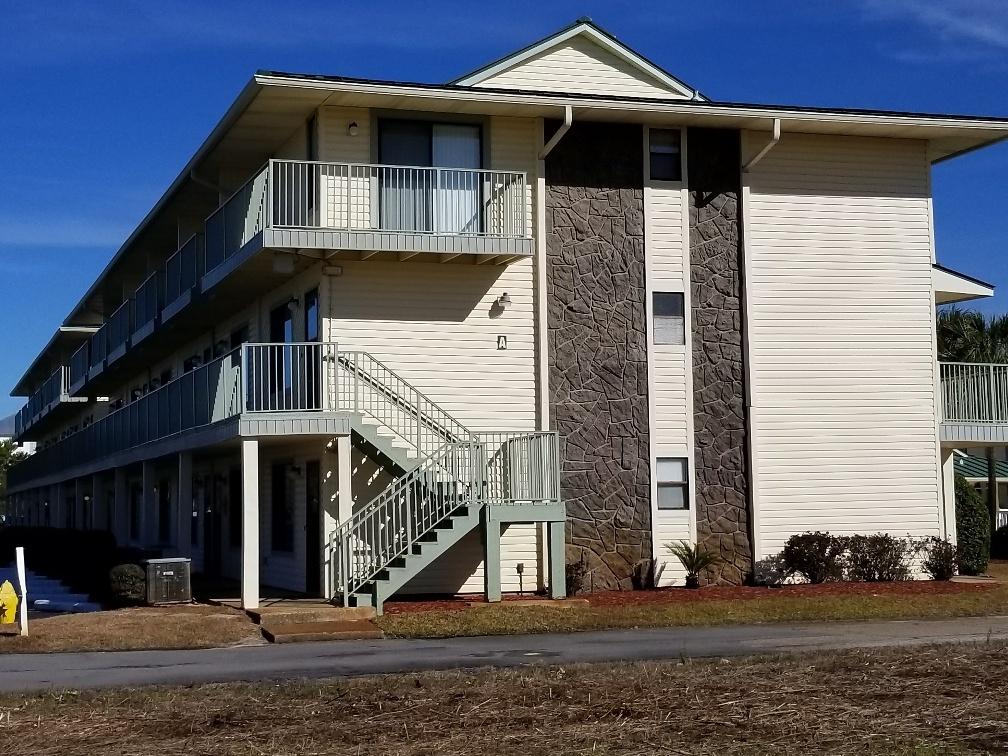 60 Sandprints Drive, Unit A2 Miramar Beach, FL 32550 - Photo 2 of 23 a front view of a house with a yard