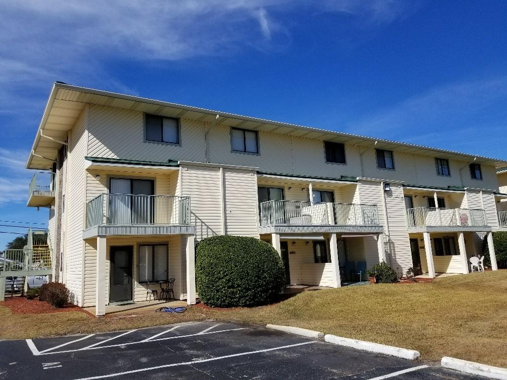 60 Sandprints Drive, Unit A2 Miramar Beach, FL 32550 - Photo 3 of 23 a front view of a house with a yard