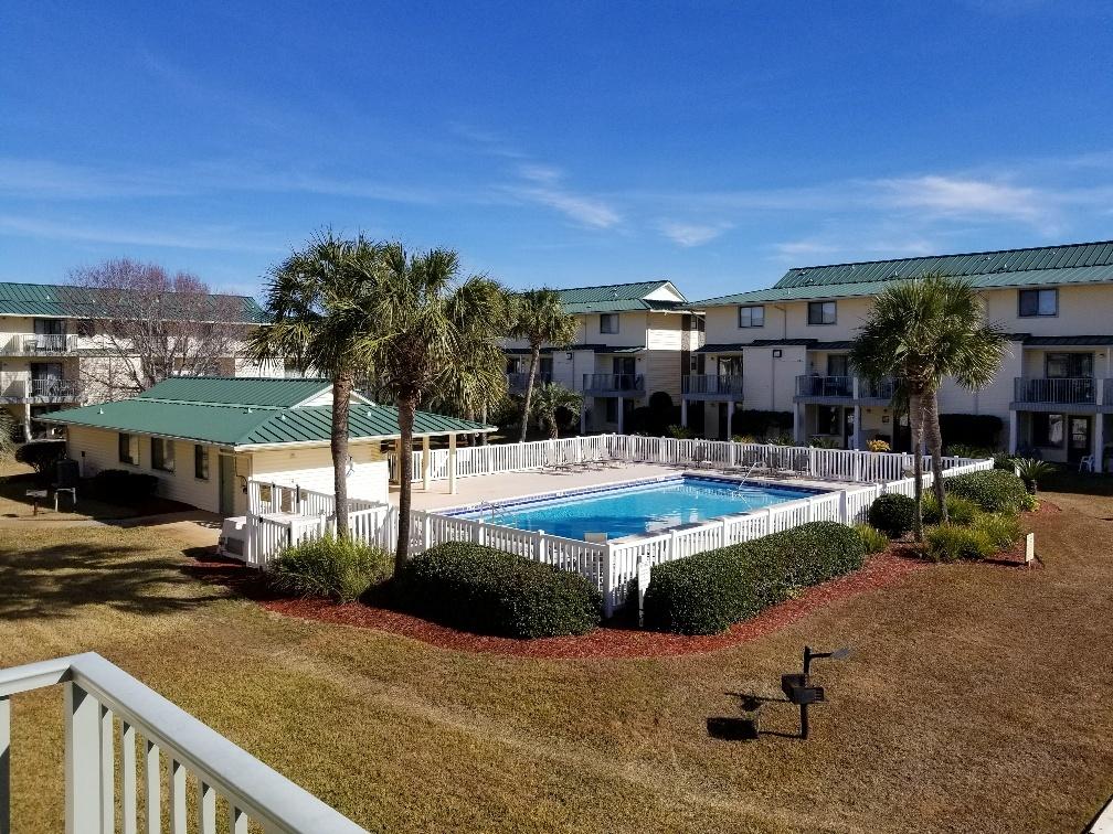 60 Sandprints Drive, Unit A2 Miramar Beach, FL 32550 - Photo 4 of 23 a view of a swimming pool with an outdoor seating