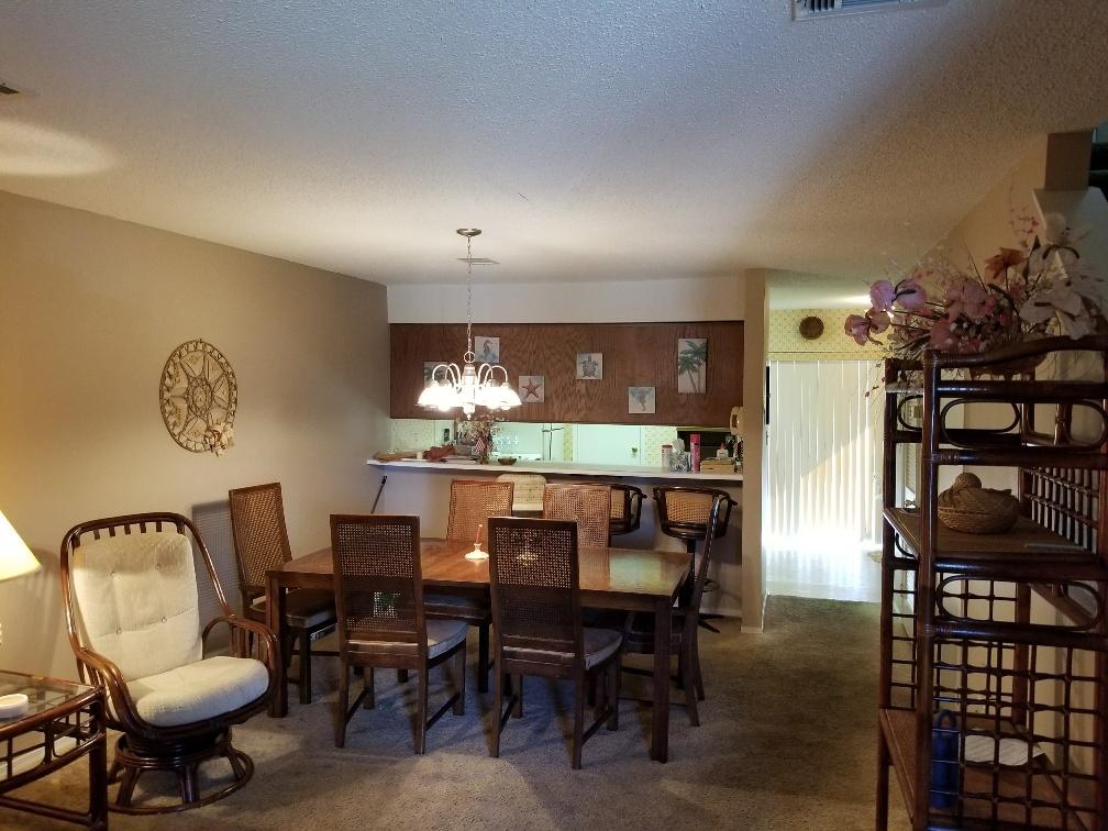 60 Sandprints Drive, Unit A2 Miramar Beach, FL 32550 - Photo 9 of 23 a view of a dining room with furniture