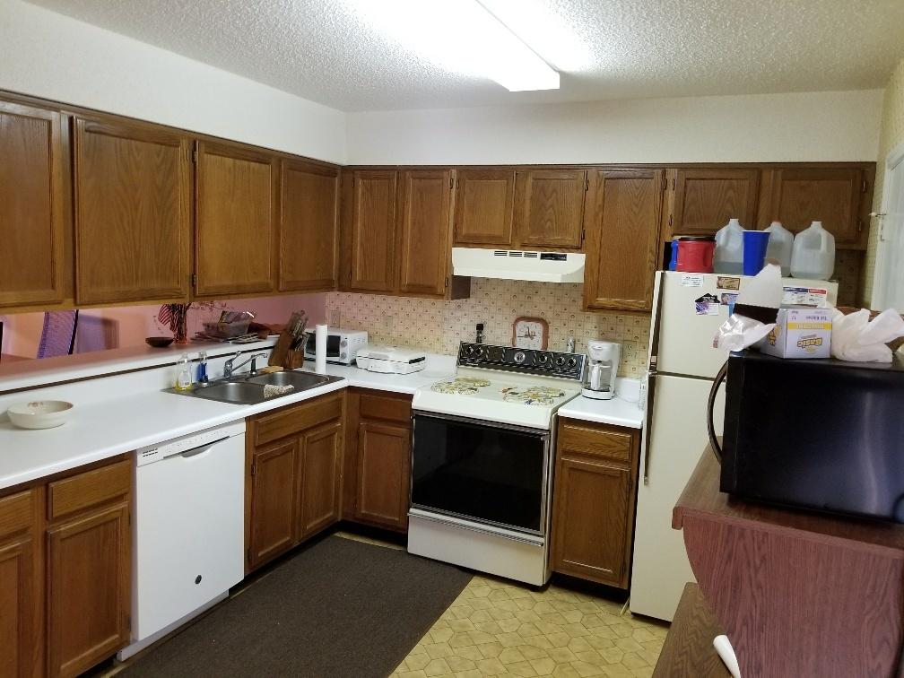 60 Sandprints Drive, Unit A2 Miramar Beach, FL 32550 - Photo 10 of 23 a kitchen with a sink dishwasher and cabinets