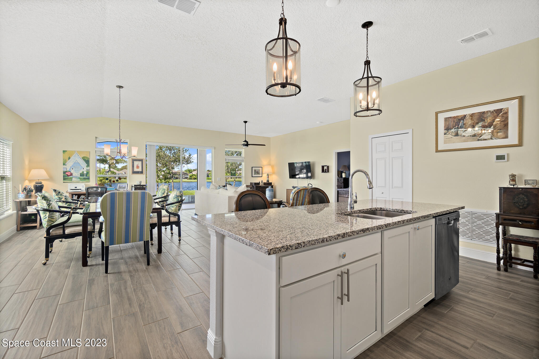 4465 Ruthann Circle Melbourne, FL 32934 - Photo 11 of 42 a view of a dining room and chairs with wooden floor