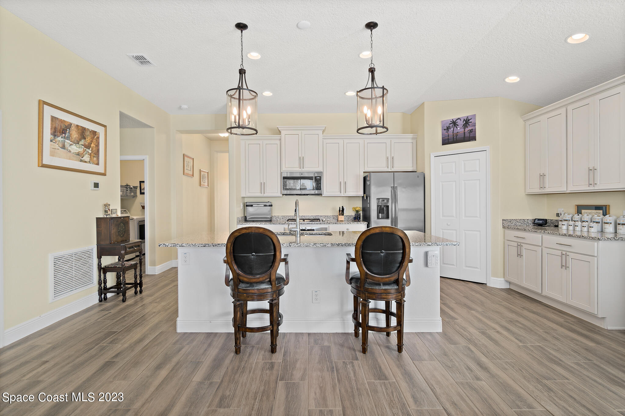 4465 Ruthann Circle Melbourne, FL 32934 - Photo 14 of 42 a view of a dining room with furniture and wooden floor