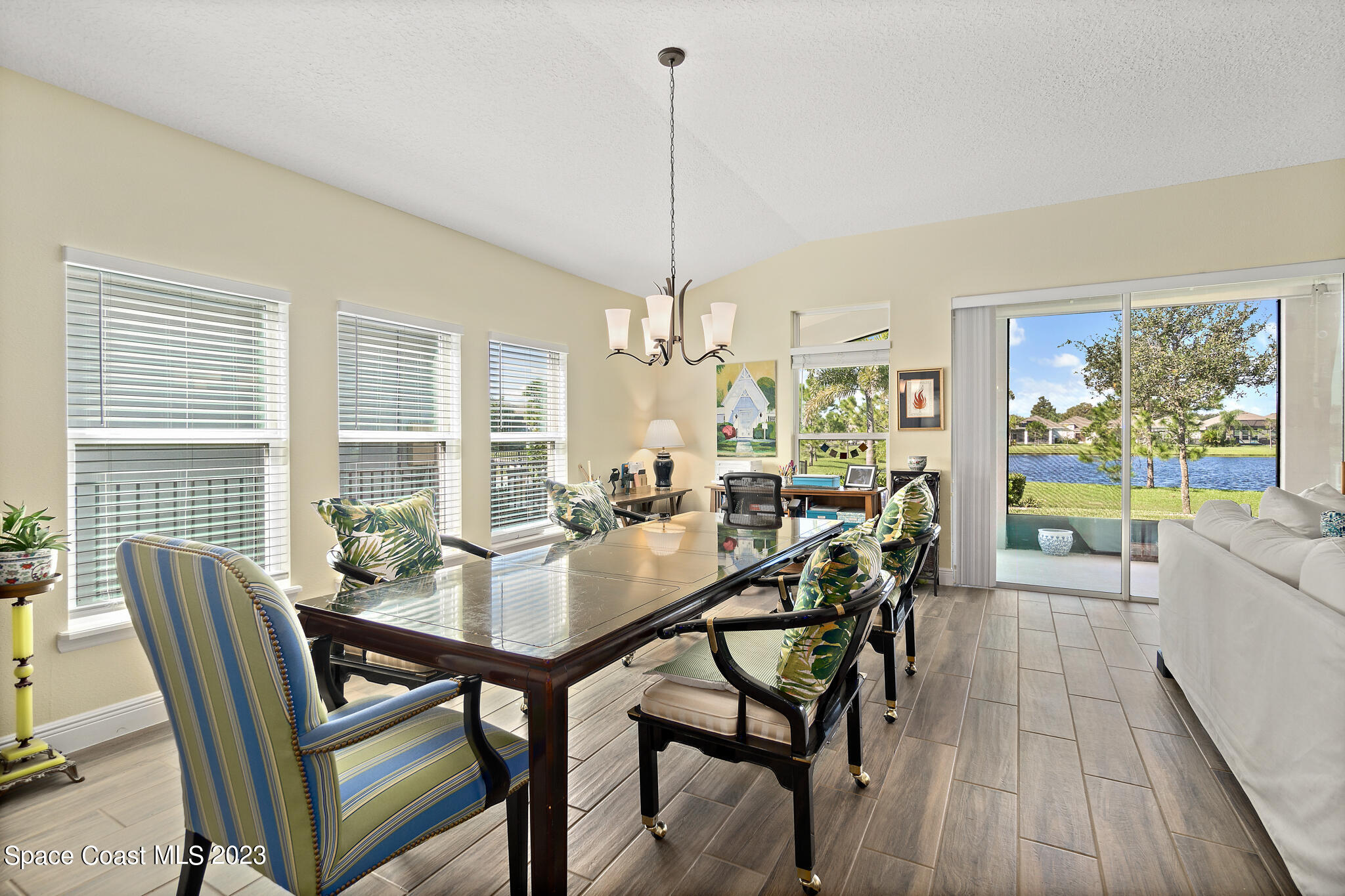 4465 Ruthann Circle Melbourne, FL 32934 - Photo 15 of 42 a view of a dining room with furniture window and outside view