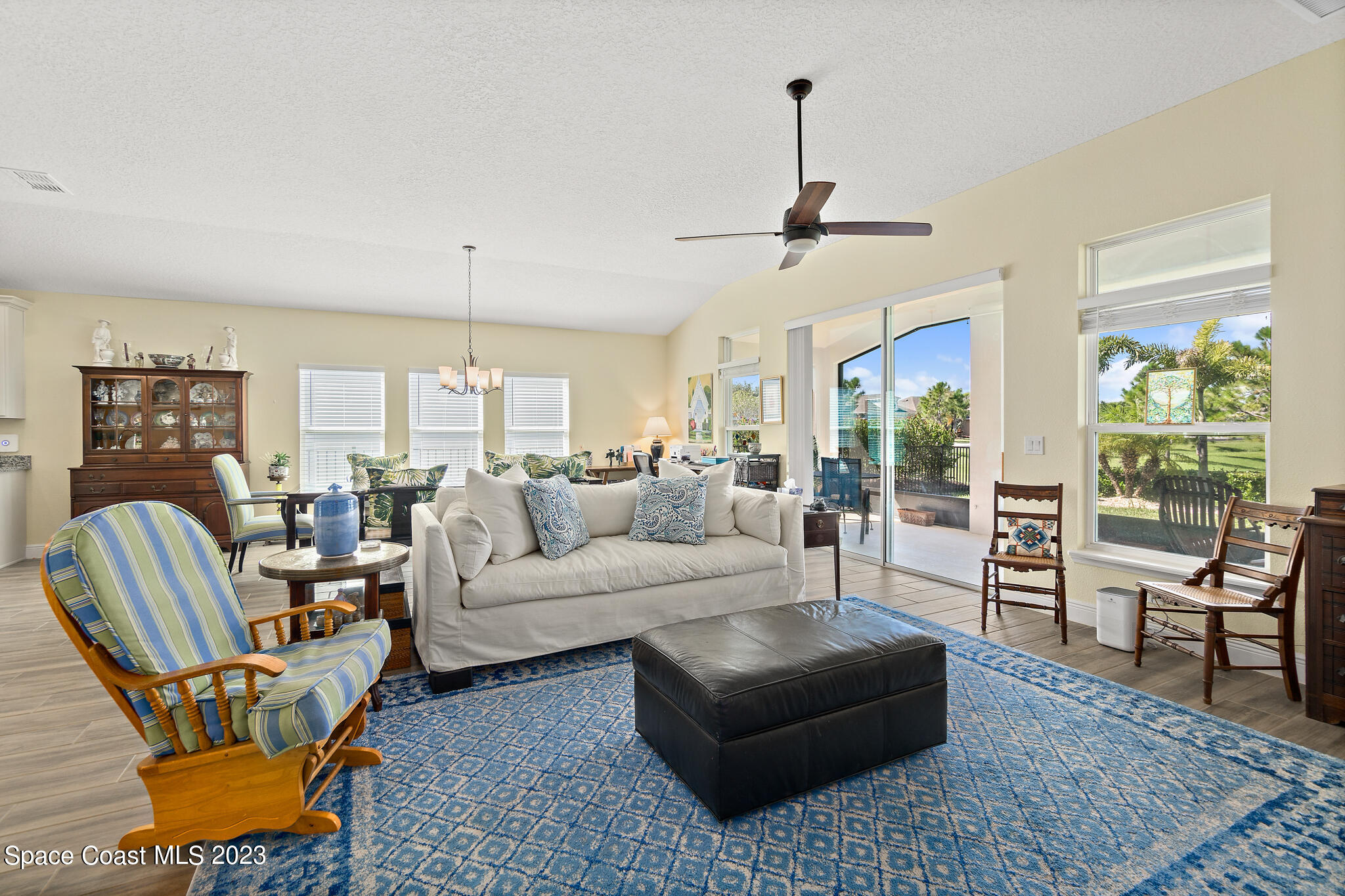 4465 Ruthann Circle Melbourne, FL 32934 - Photo 17 of 42 a living room with furniture ceiling fan and a window