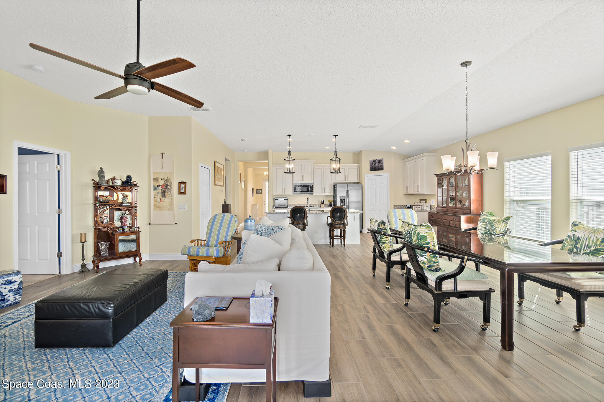 4465 Ruthann Circle Melbourne, FL 32934 - Photo 19 of 42 a living room with furniture and a wooden floor