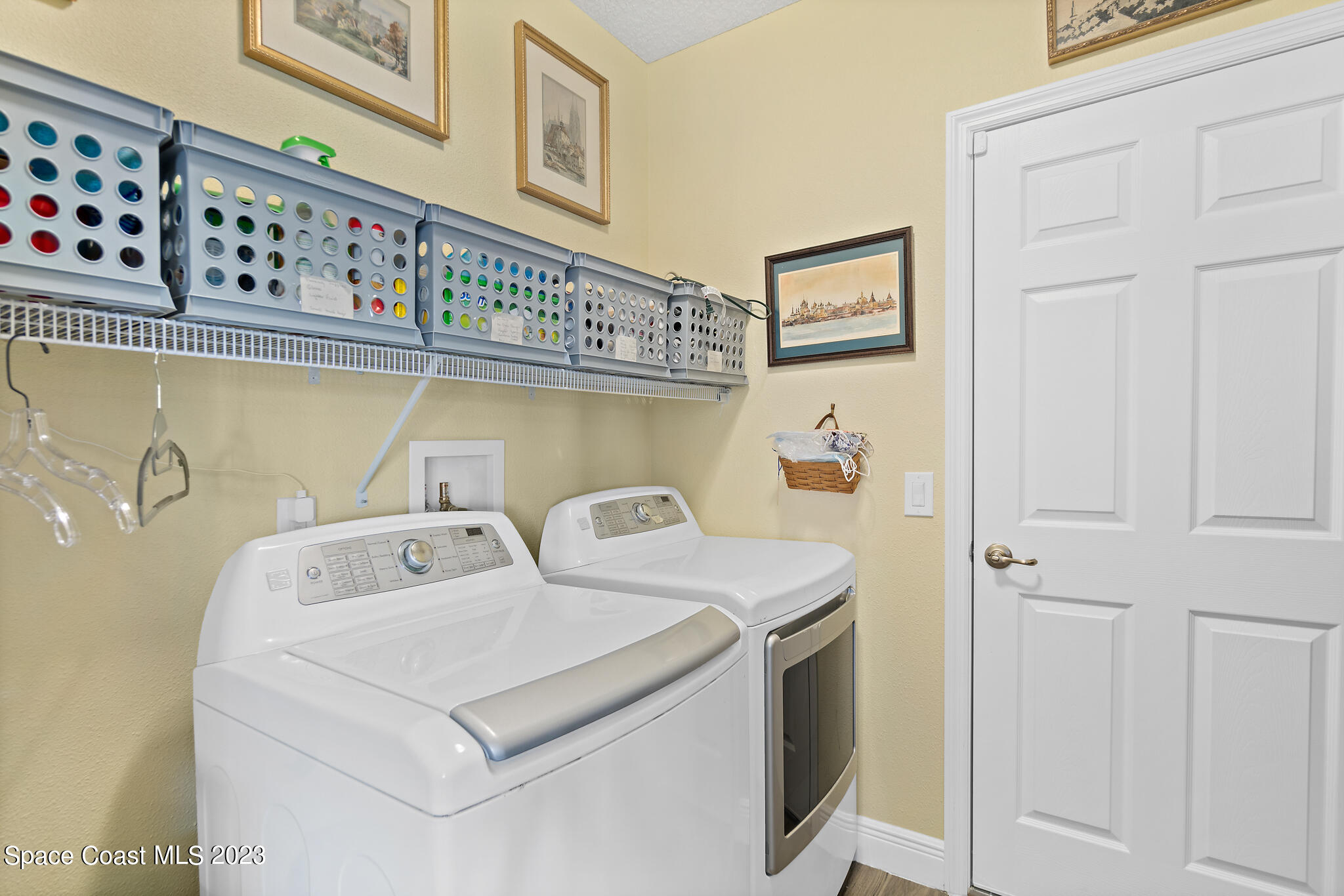 4465 Ruthann Circle Melbourne, FL 32934 - Photo 30 of 42 a utility room with dryer and washer