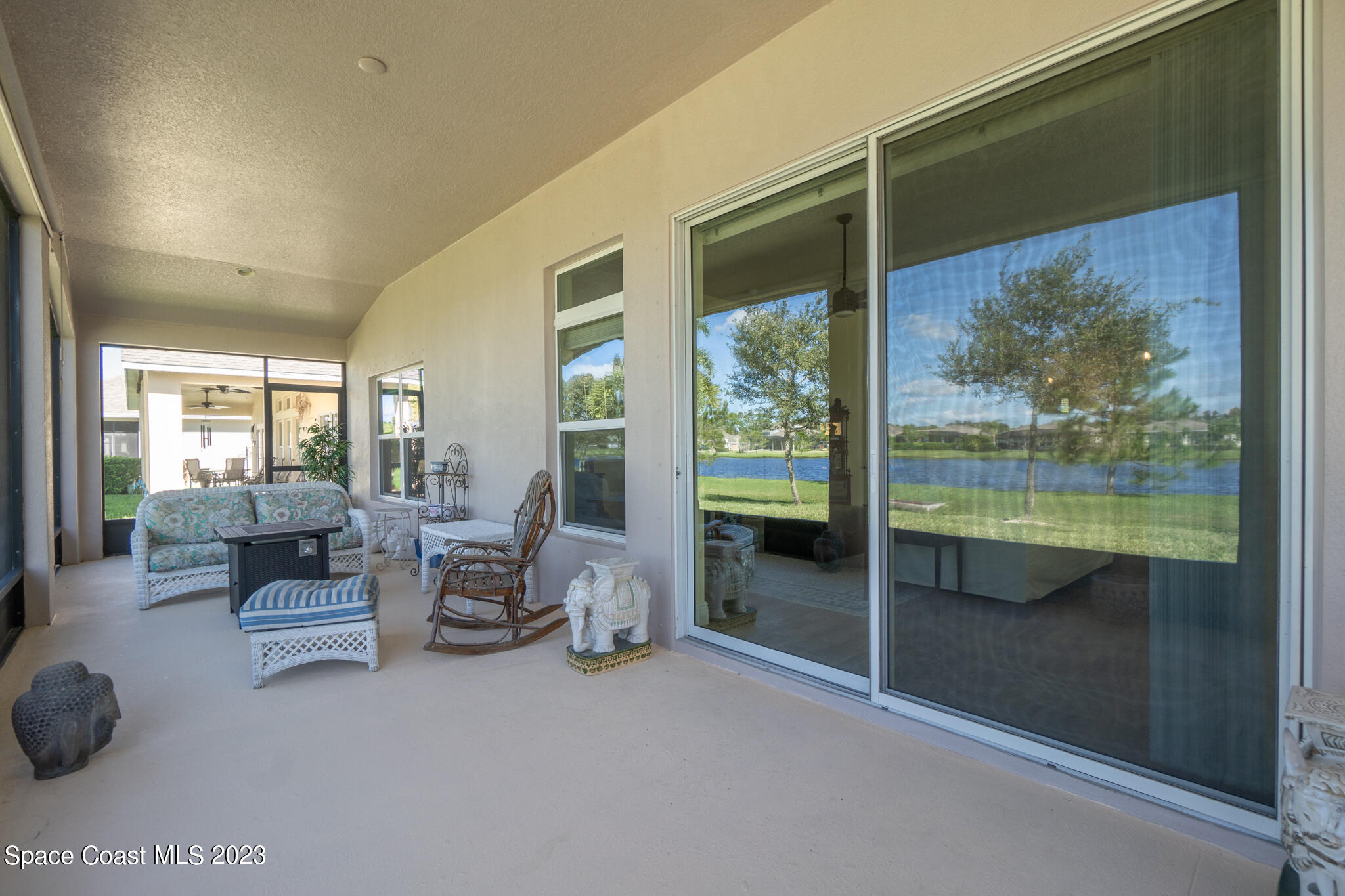 4465 Ruthann Circle Melbourne, FL 32934 - Photo 32 of 42 a living room with furniture and a large window