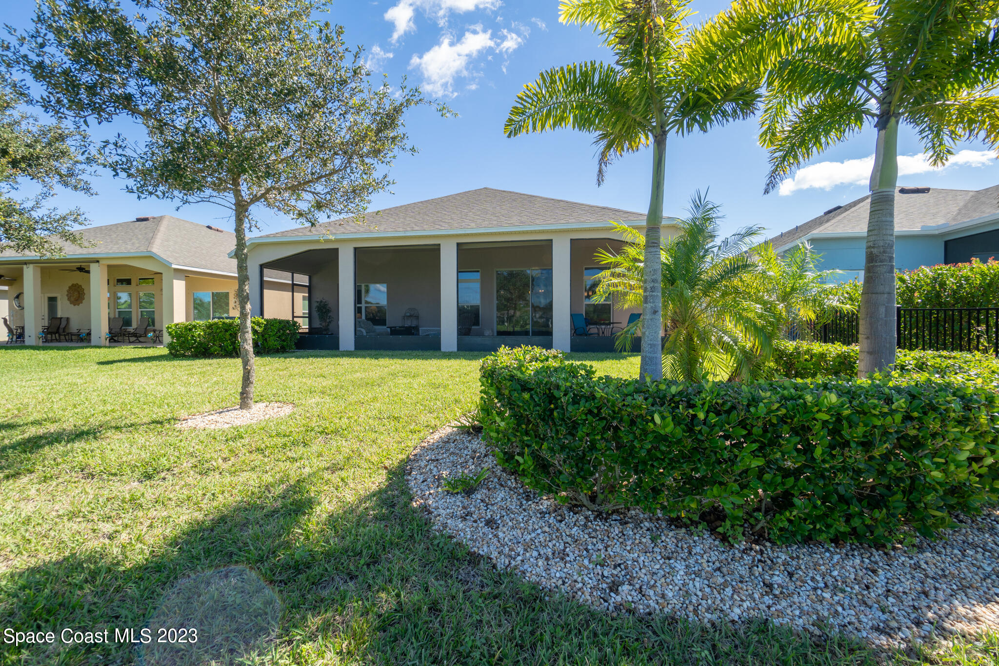 4465 Ruthann Circle Melbourne, FL 32934 - Photo 35 of 42 a front view of a house with a garden